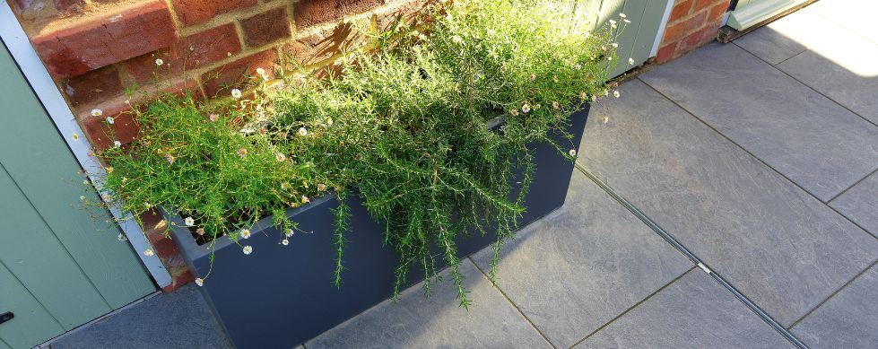 Brickslot satinless steel Complete the Look Grate in courtyard paving