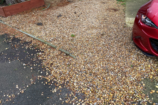 Gravel scattering beyond domestic driveway