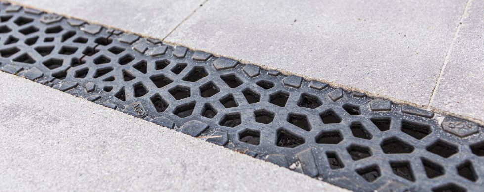Voronoi Complete the Look grating installed in paving