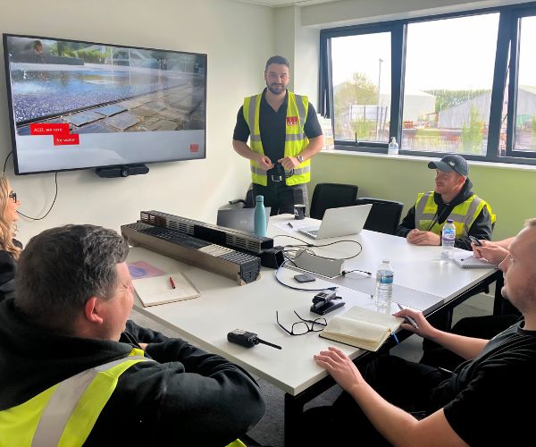 ACO's trainer Adam Donnaloia delivering training to merchant staff