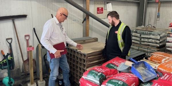 Area Sales Manager Dean Morgan interacting with merchant staff